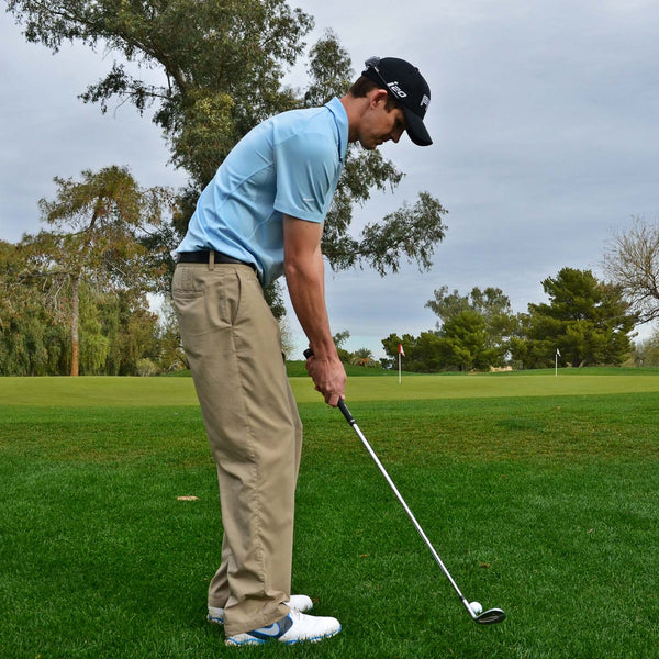 Golfer lining up a shot.