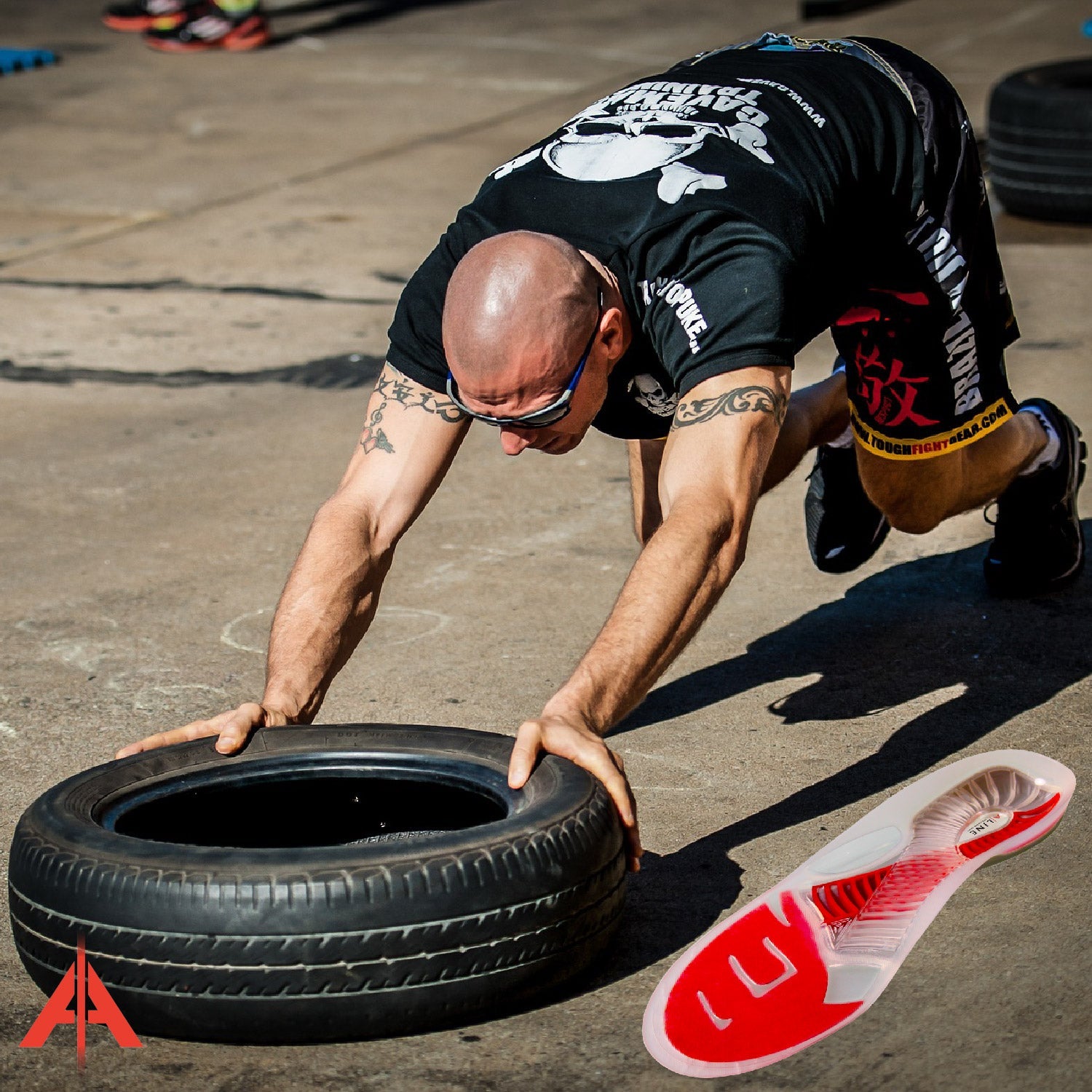 Man pushing a tire with ALINE Insoles.